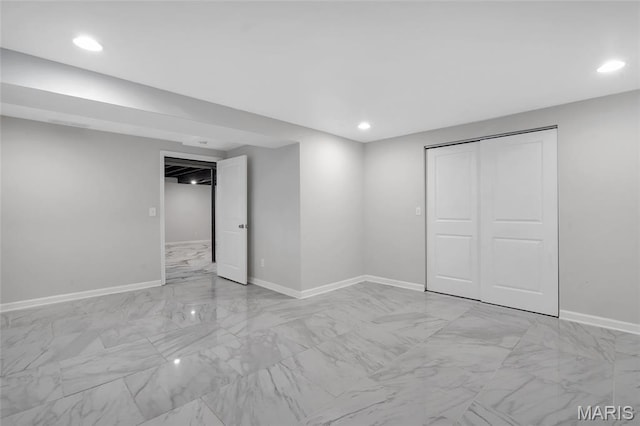 904 Ampere Pl, Lake St Louis, MO 63367 - unfurnished bedroom featuring light marble finish flooring, recessed lighting, and a closet