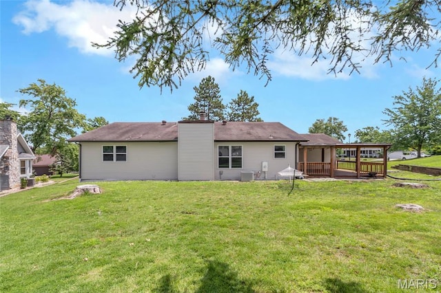 904 Ampere Pl, Lake St Louis, MO 63367 - rear view of house with a lawn and a chimney