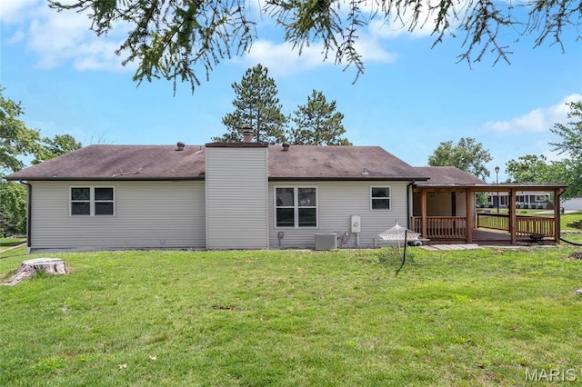 904 Ampere Pl, Lake St Louis, MO 63367 - back of house featuring a deck, a yard, and a chimney
