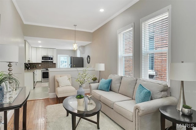3253 Walter Ave, Maplewood, MO 63143 - living area with crown molding, light wood-style floors, and recessed lighting