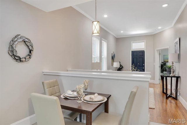 3253 Walter Ave, Maplewood, MO 63143 - dining room with crown molding, light wood-style flooring, and recessed lighting
