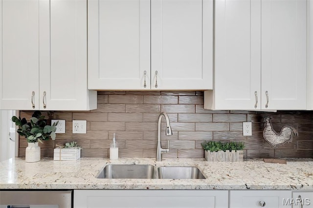3253 Walter Ave, Maplewood, MO 63143 - kitchen featuring white cabinets, decorative backsplash, and light stone countertops