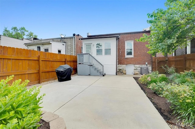 3253 Walter Ave, Maplewood, MO 63143 - rear view of house featuring a patio area and brick siding