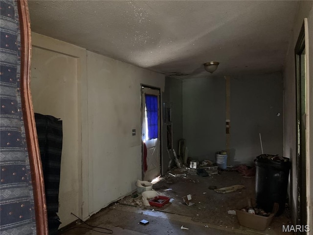 8268 Brenner Ave, Saint Louis, MO 63114 - unfurnished room featuring a textured ceiling