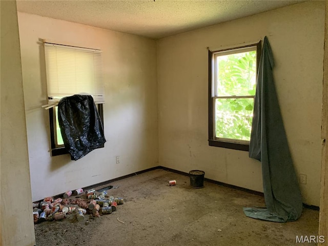 8268 Brenner Ave, Saint Louis, MO 63114 - empty room with a textured ceiling and baseboards