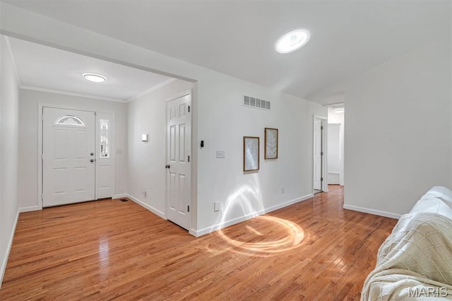 3848 Bedford Pointe Dr, Wentzville, MO 63385 - foyer entrance with light wood-style floors and crown molding