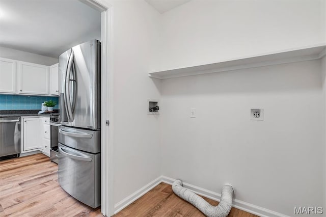 3848 Bedford Pointe Dr, Wentzville, MO 63385 - washroom with electric dryer hookup and light wood finished floors