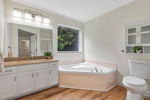 3848 Bedford Pointe Dr, Wentzville, MO 63385 - full bath with crown molding, a garden tub, a stall shower, vanity, and wood finished floors