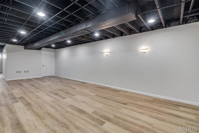 3848 Bedford Pointe Dr, Wentzville, MO 63385 - finished below grade area featuring baseboards and wood finished floors