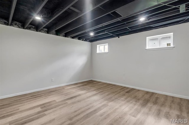 3848 Bedford Pointe Dr, Wentzville, MO 63385 - basement featuring wood finished floors and baseboards