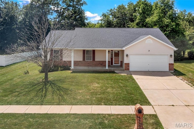 3848 Bedford Pointe Dr, Wentzville, MO 63385 - view of front of house featuring brick siding, an attached garage, covered porch, driveway, and a front lawn