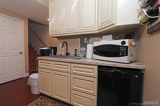 3576 Mill View Xing, Cape Girardeau, MO 63701 - kitchen with white microwave, cream cabinetry, light countertops, refrigerator, and black dishwasher