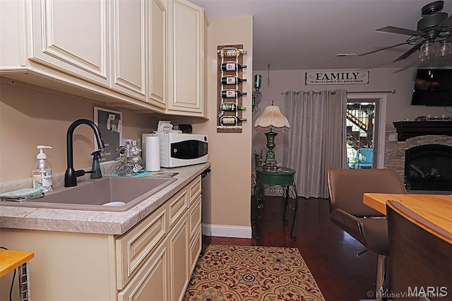 3576 Mill View Xing, Cape Girardeau, MO 63701 - kitchen with white microwave, ceiling fan, butcher block countertops, and a fireplace