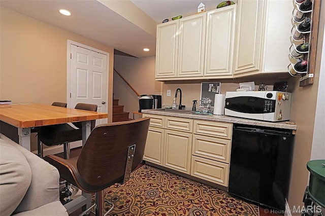 3576 Mill View Xing, Cape Girardeau, MO 63701 - kitchen featuring white microwave, dishwasher, cream cabinetry, recessed lighting, and butcher block counters