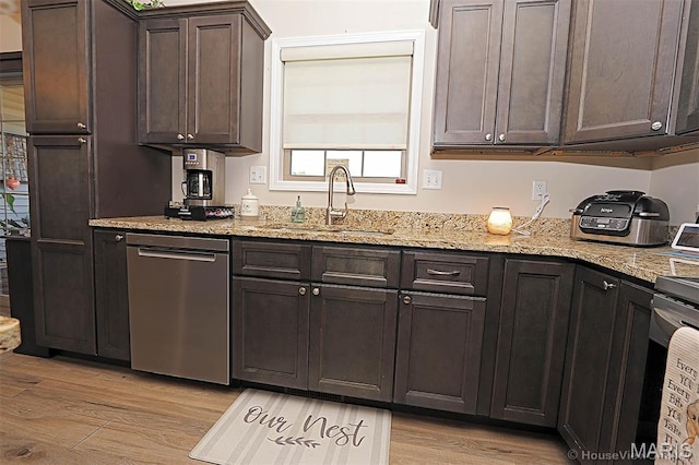 3576 Mill View Xing, Cape Girardeau, MO 63701 - kitchen featuring stainless steel dishwasher, light wood-style flooring, dark brown cabinets, and light stone countertops