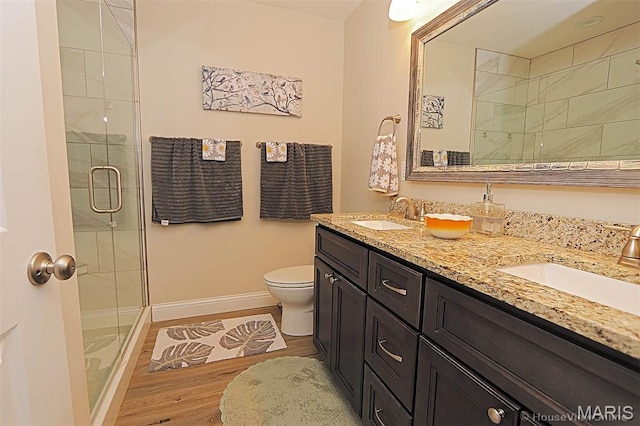3576 Mill View Xing, Cape Girardeau, MO 63701 - bathroom featuring double vanity, a stall shower, and wood finished floors