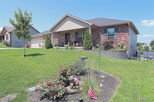 3576 Mill View Xing, Cape Girardeau, MO 63701 - ranch-style house with brick siding, a garage, covered porch, and a front yard