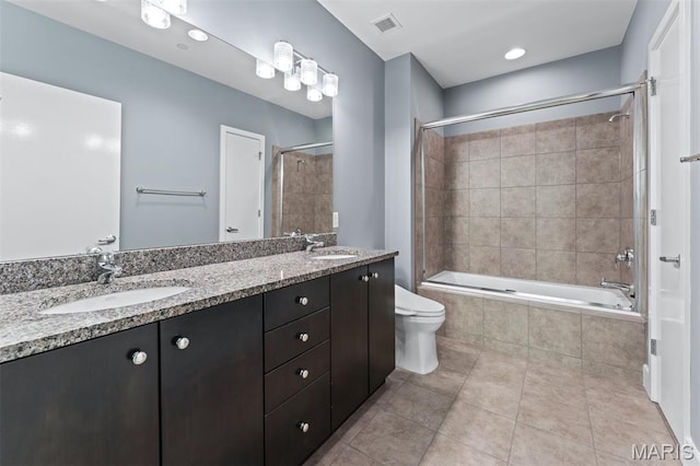 8025 Maryland Ave Unit 8H, Clayton, MO 63105 - bathroom featuring tiled shower / bath, double vanity, and tile patterned flooring
