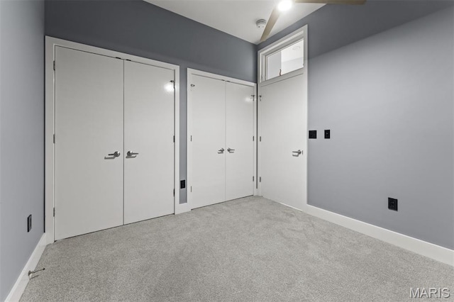 8025 Maryland Ave Unit 8H, Clayton, MO 63105 - unfurnished bedroom featuring two closets and carpet flooring