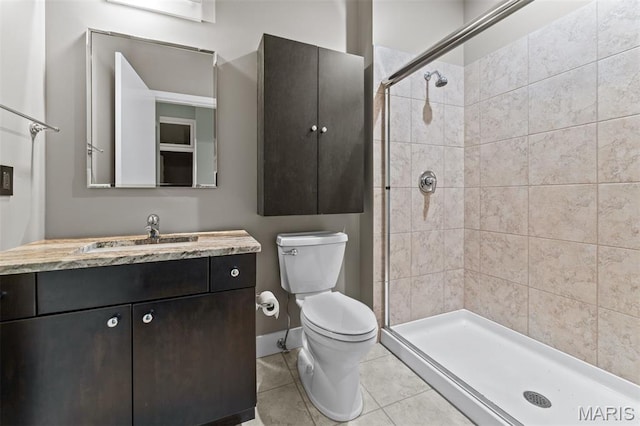 8025 Maryland Ave Unit 8H, Clayton, MO 63105 - bathroom featuring vanity, tiled shower, and tile patterned flooring