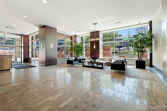 8025 Maryland Ave Unit 8H, Clayton, MO 63105 - common area featuring a wall of windows, recessed lighting, and a security system