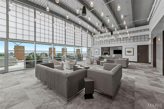 8025 Maryland Ave Unit 8H, Clayton, MO 63105 - community lobby with a towering ceiling and beamed ceiling