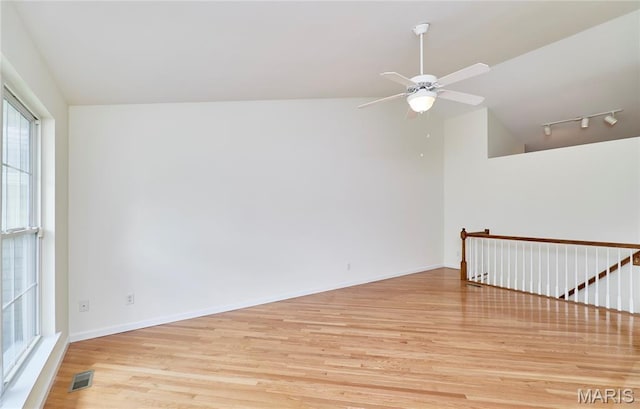 108 Fort Worth Way, Wright City, MO 63390 - empty room with light wood-style flooring, vaulted ceiling, track lighting, and ceiling fan