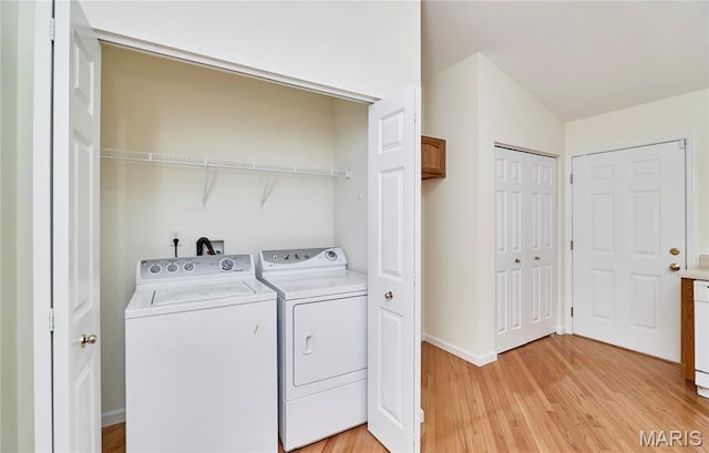 108 Fort Worth Way, Wright City, MO 63390 - laundry room with washer and dryer and light wood-style floors