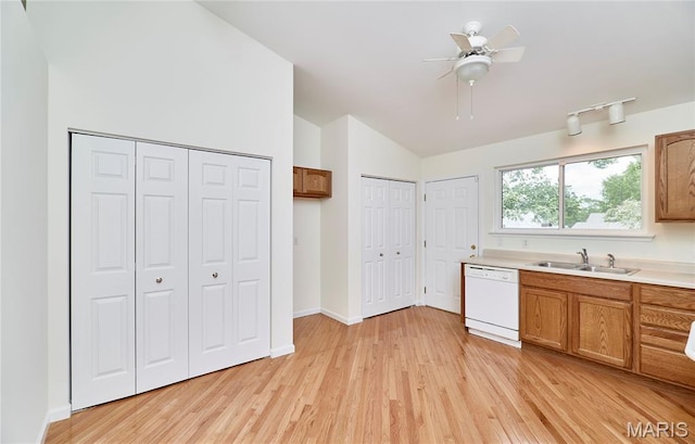 108 Fort Worth Way, Wright City, MO 63390 - kitchen featuring dishwasher, lofted ceiling, light wood-style flooring, light countertops, and brown cabinets