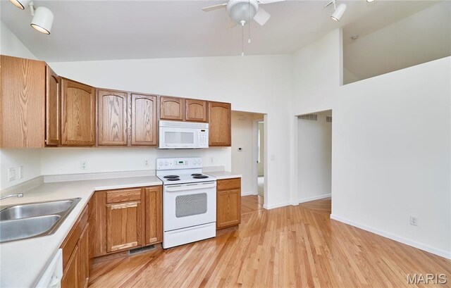 108 Fort Worth Way, Wright City, MO 63390 - kitchen featuring white appliances, high vaulted ceiling, a ceiling fan, light wood-style floors, and light countertops