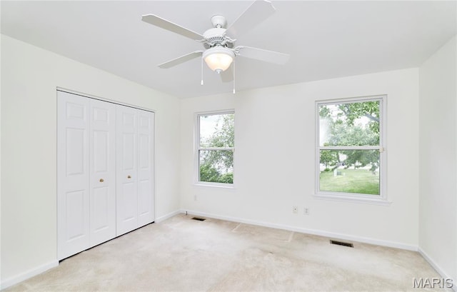 108 Fort Worth Way, Wright City, MO 63390 - unfurnished bedroom with light colored carpet, a closet, and a ceiling fan
