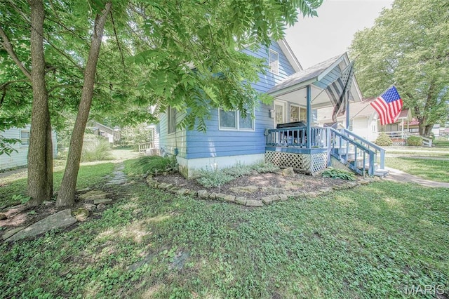 110 S Oak St, Rolla, MO 65401 - view of side of property featuring a lawn and a porch