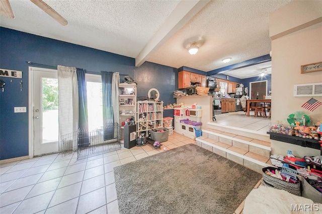 110 S Oak St, Rolla, MO 65401 - living room with ceiling fan, a textured ceiling, tile patterned flooring, and beamed ceiling