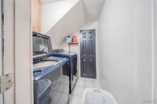 110 S Oak St, Rolla, MO 65401 - laundry area featuring separate washer and dryer, a textured ceiling, and light tile patterned floors