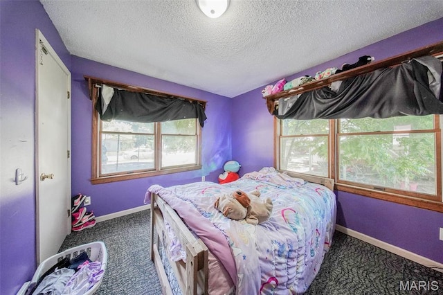 110 S Oak St, Rolla, MO 65401 - bedroom with a textured ceiling and carpet