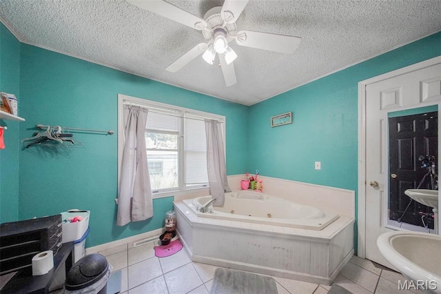 110 S Oak St, Rolla, MO 65401 - bathroom with a jetted tub, a textured ceiling, tile patterned flooring, and ceiling fan