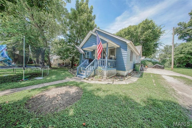 110 S Oak St, Rolla, MO 65401 - bungalow-style home with a trampoline, a porch, a front lawn, and driveway