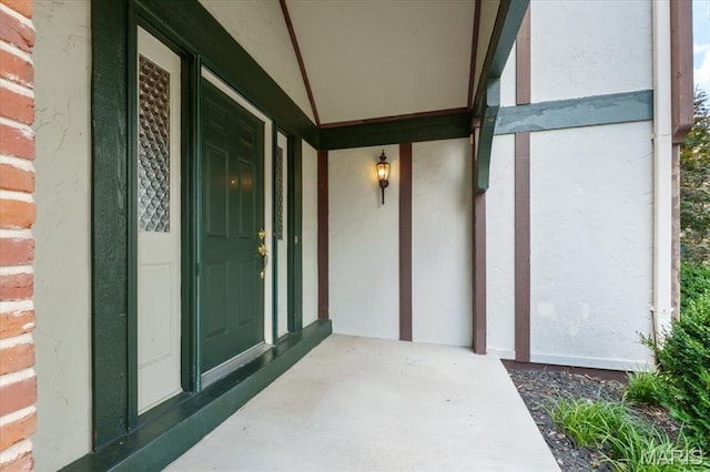 15693 Dresden Lake Ct, Chesterfield, MO 63017 - view of exterior entry featuring covered porch and stucco siding