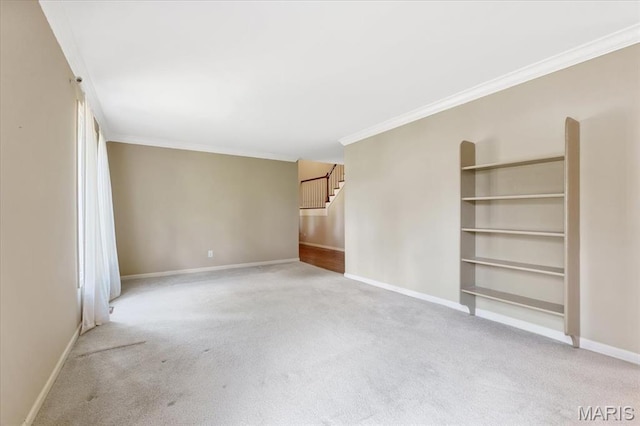 15693 Dresden Lake Ct, Chesterfield, MO 63017 - spare room featuring light carpet, crown molding, stairway, and built in features