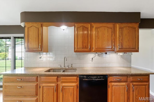 15693 Dresden Lake Ct, Chesterfield, MO 63017 - kitchen featuring black dishwasher, backsplash, and brown cabinetry