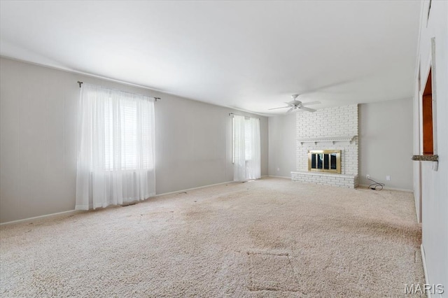 15693 Dresden Lake Ct, Chesterfield, MO 63017 - unfurnished living room with ceiling fan, a fireplace, and carpet flooring