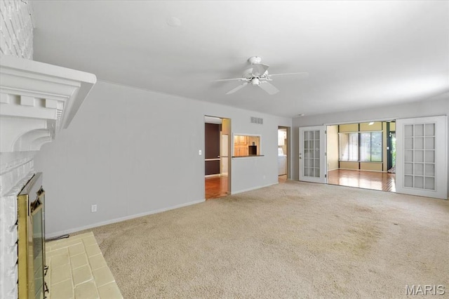 15693 Dresden Lake Ct, Chesterfield, MO 63017 - unfurnished living room with a ceiling fan, a fireplace, and carpet