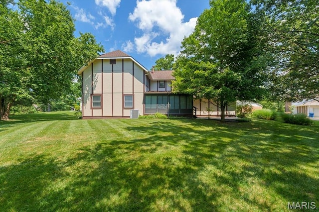 15693 Dresden Lake Ct, Chesterfield, MO 63017 - back of house with a yard, a sunroom, and stucco siding