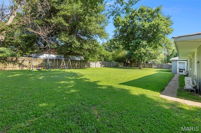 503 Emerson St, Kennett, MO 63857 - fenced backyard featuring a playground