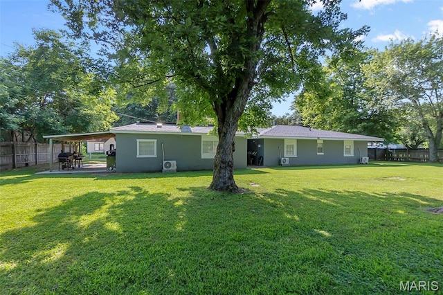 503 Emerson St, Kennett, MO 63857 - back of house with a fenced backyard, a patio area, and stucco siding