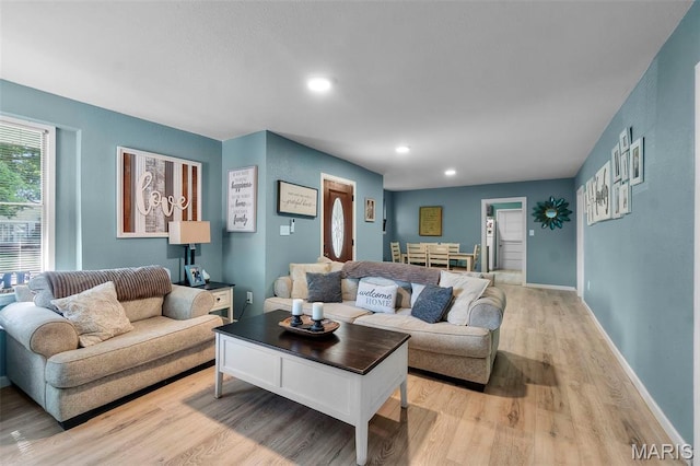 503 Emerson St, Kennett, MO 63857 - living room featuring light wood-type flooring and recessed lighting