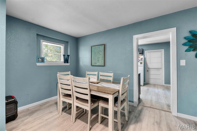 503 Emerson St, Kennett, MO 63857 - dining room featuring wood finished floors and baseboards