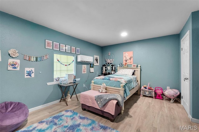 503 Emerson St, Kennett, MO 63857 - bedroom featuring wood finished floors and a wall mounted air conditioner