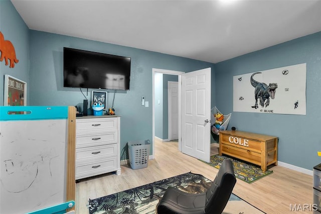 503 Emerson St, Kennett, MO 63857 - bedroom featuring light wood-style floors and baseboards