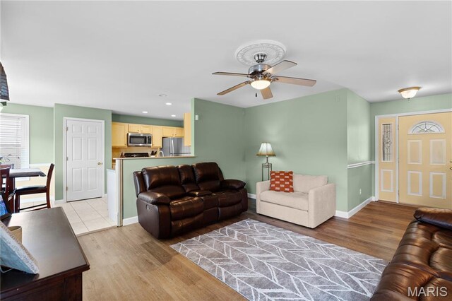 4632 Greenore Dr, High Ridge, MO 63049 - living area featuring light wood-style flooring and ceiling fan